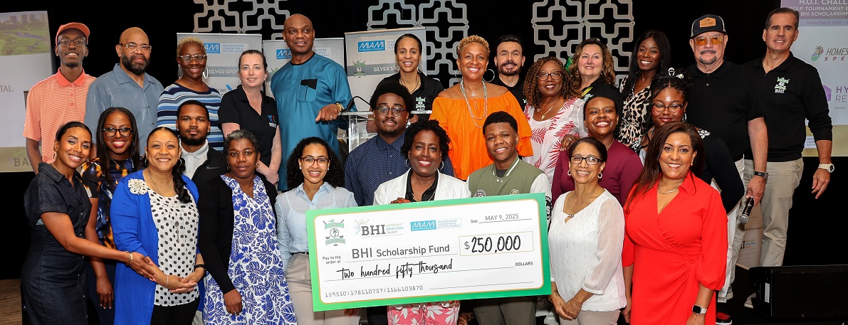  Image of the H.O.T. Challenge Fund raising check with students & alumnis